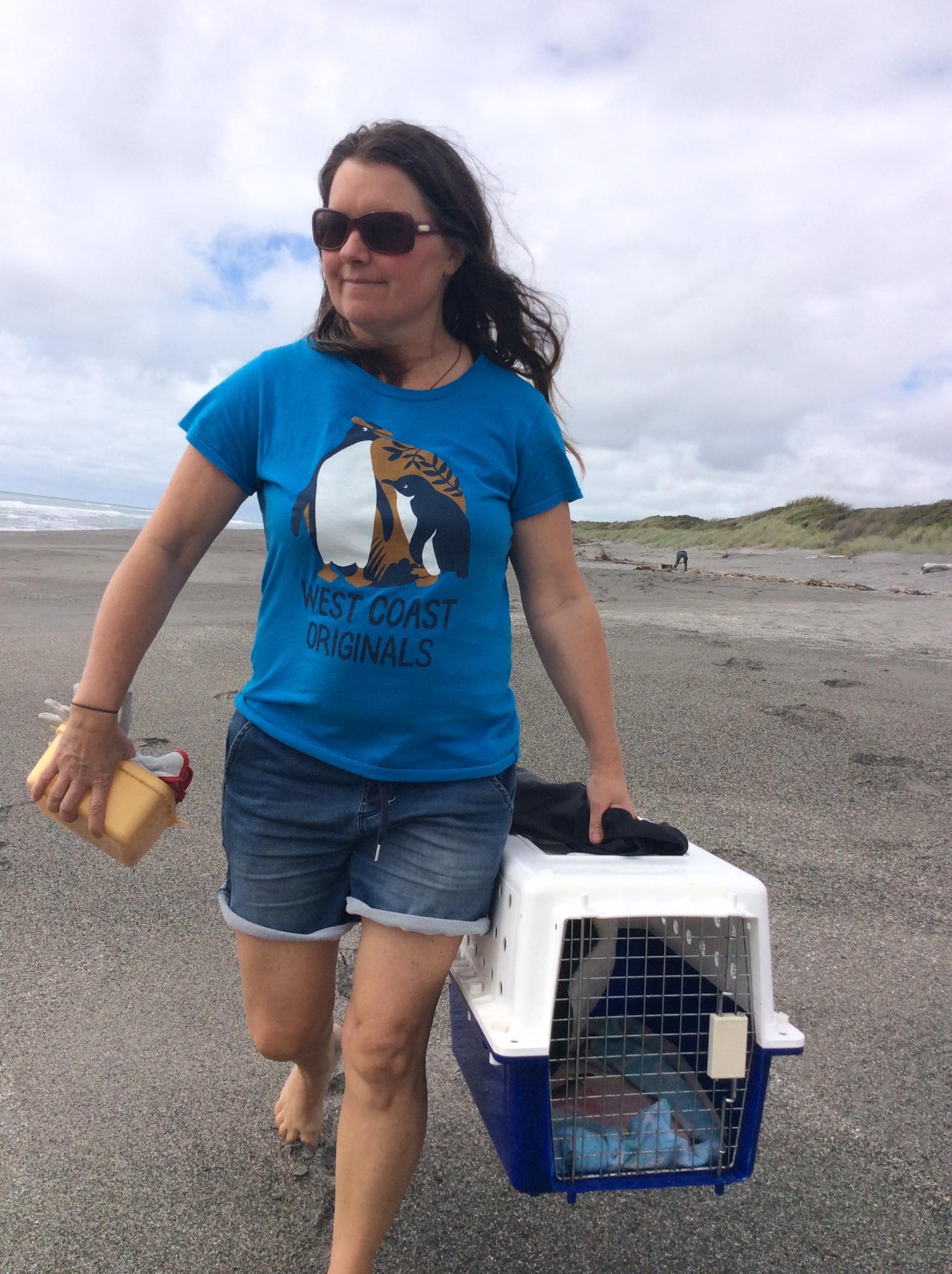 Tracy returns Falcon the tawaki to the beach